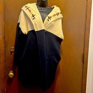 No tag. Thick, embroidered collar and hood